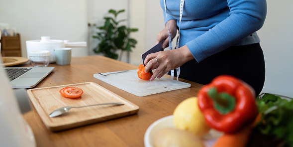 Fat women exercise healthily at home on leisurely day happily. overweight wellness at home concept.