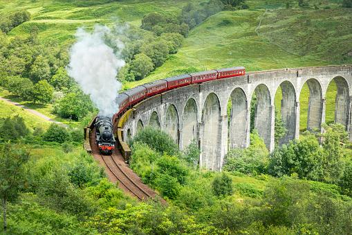 The Jacobite steam train on Glenfinnan viaduct in North West Highlands, Scotland, UK