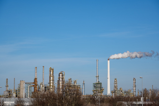 Aerial view of coal power plant high pipes with black smokestack polluting atmosphere. Electricity production with fossil fuel concept.