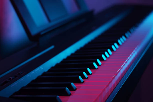 istock Neon light, interior. Close up professional classical piano keys 1974778138