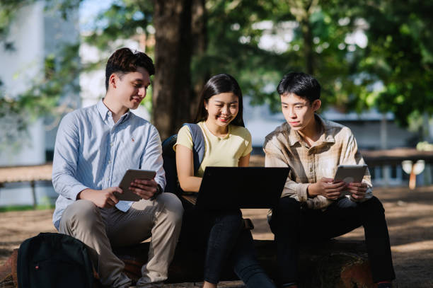 istock 3 Multiracial Group Of Students Talking In University Garden. 1974799230