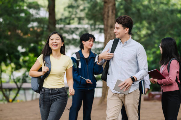 istock Young students at the college campus walking to class 1974800801