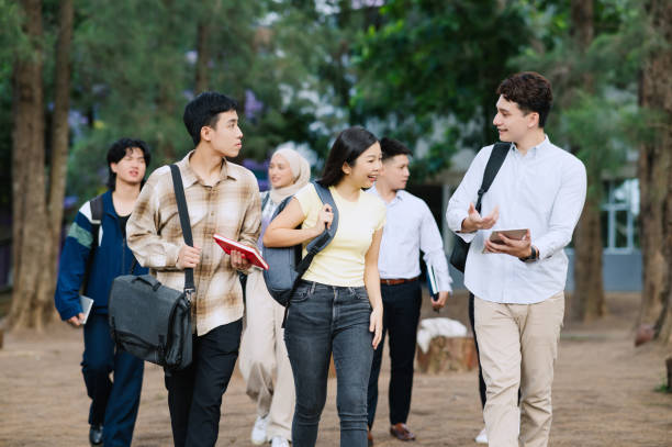 istock Young students at the college campus walking to class 1974800806