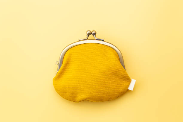 istock Coin purse on a yellow background. 1974845530