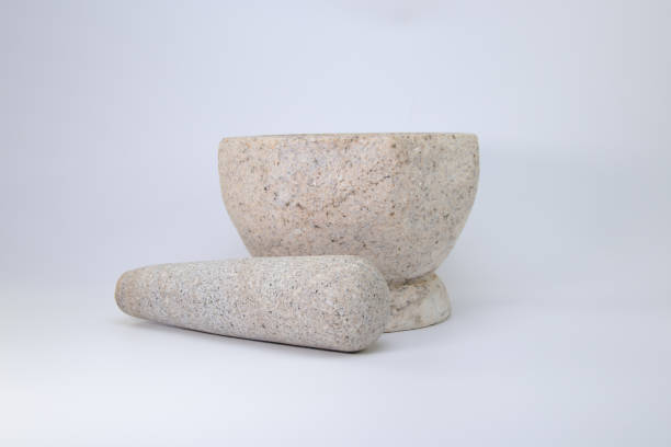 istock Stone Mortar and Pestle on White Background 1974851102