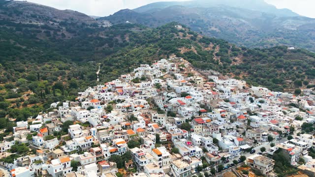 Small town in Greece on the hillside, aerial view