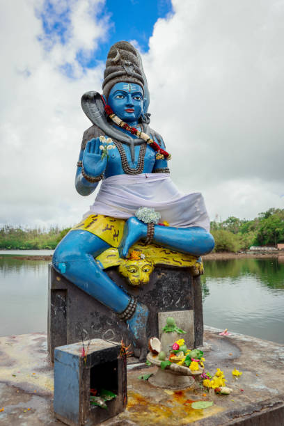 istock Hindu Statue Seated Atop Cement Block 1974876324