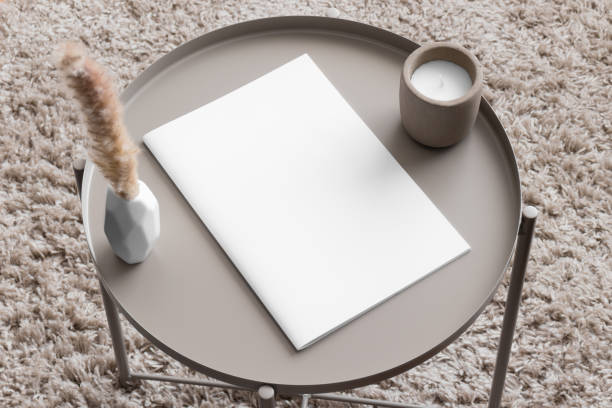 istock Magazine mockup with a candle and a pampas on the beige table. 1974916086