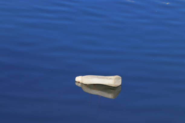 istock pollution, plastic bottle floats in a blue sea 1974916640