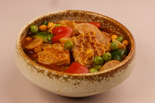 Callos is a Stew made of Ox Tripe, Smoked Sausage, Beans and Bell Peppers in Tomato Sauce. One of the Influences of Spanish Colonization on Filipino Cuisine.