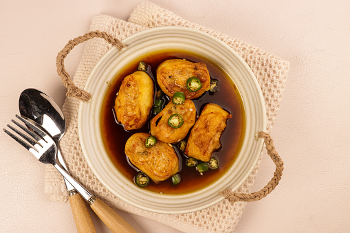 Gohyong is One of the Influences of Chinese Food on Indonesian Cuisine. Made from Minced Chicken with Flour Wrap Served with Brown Sweet and Sour Sauce.