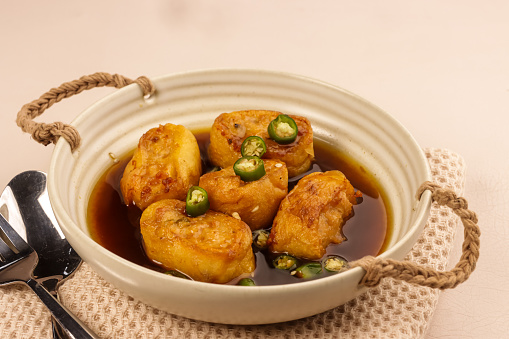 Gohyong is One of the Influences of Chinese Food on Indonesian Cuisine. Made from Minced Chicken with Flour Wrap Served with Brown Sweet and Sour Sauce.