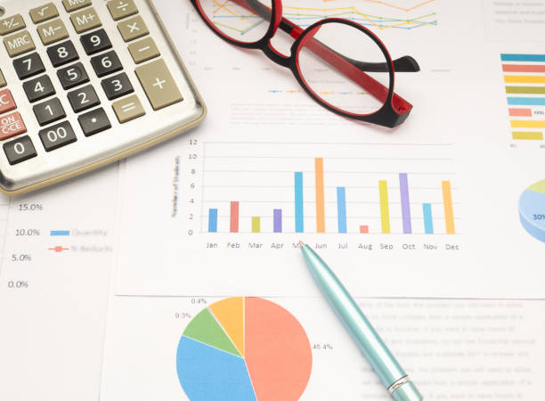 istock Top view of the work desk with business reports background. 1974922054