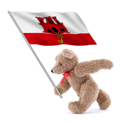 A Gibraltar flag being carried by a cute teddy bear