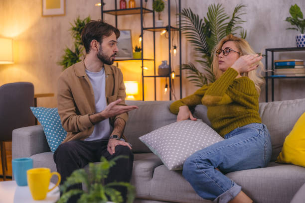 istock Young couple arguing and fighting at home 1974968378