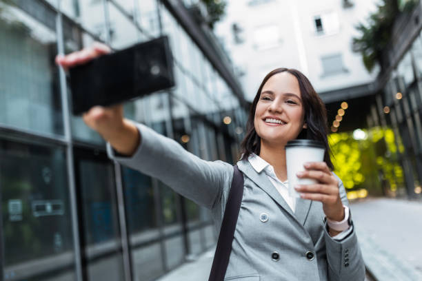 istock Streetwise Businesswoman making Selfie 1974981702