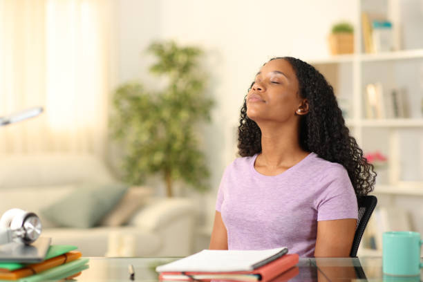 Black student breathing and relaxing at home