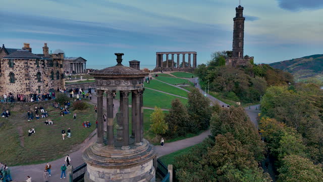 Aerial view of Calton Hill, Edinburgh sunset aerial view, Gothic Revival architecture in Scotland, View of Edinburgh city center from Calton Hill