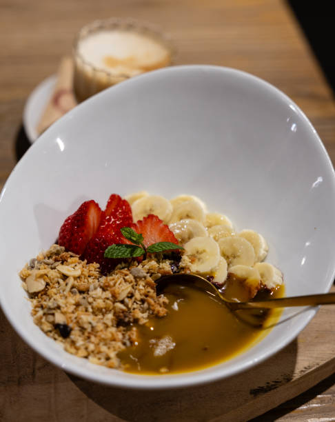istock Healthy granola bowl with fresh fruit and honey, copy space. 1974997679