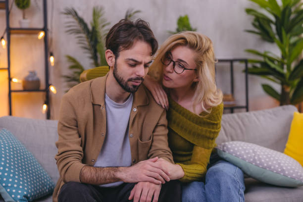 istock Young woman consoling her sad friend 1975003533