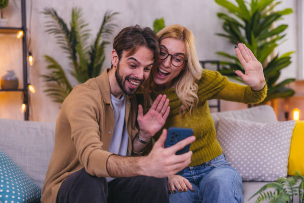istock Beautiful young couple on video call 1975006173