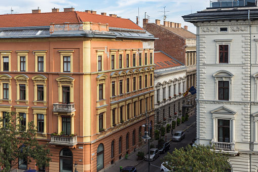 Beautiful vintage buldings decorative windows in urban Budapest on nice day