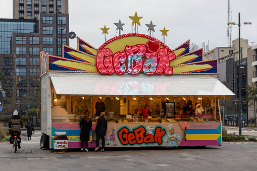 Eindhoven, the Netherlands. 7 January 2023. Gebak stall. A pastry stall is a stall where fried dough dishes are prepared and sold, such as oil and raisin buns, Berliner buns, apple fritters and waffles.