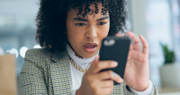 istock Business woman, phone and night with stress, error and reading for problem solving for communication. Entrepreneur, smartphone and 404 glitch with networking, mobile app and frustrated face in office 1975040019