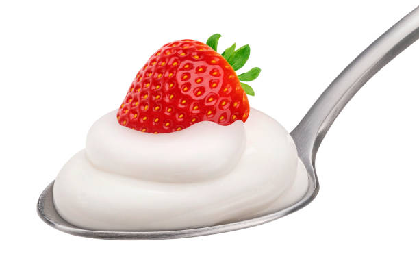 Strawberry yogurt in spoon isolated on white background