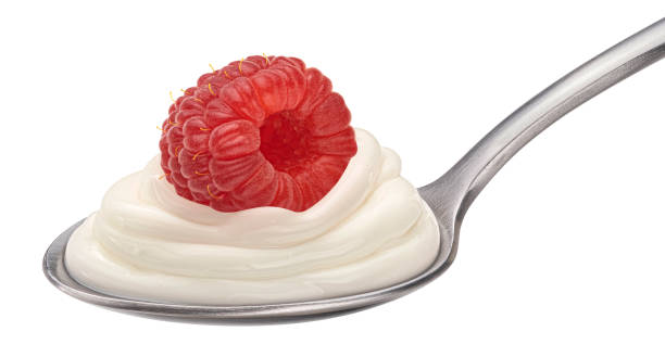istock Spoon of yogurt with raspberry isolated on white background 1975071112