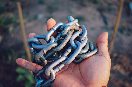 iron chain in hand