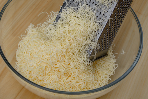 Yellow Gouda cheese, grated on small holes