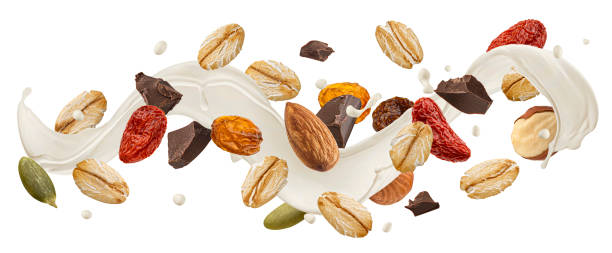 istock Falling muesli with milk splash isolated on white background 1975096333