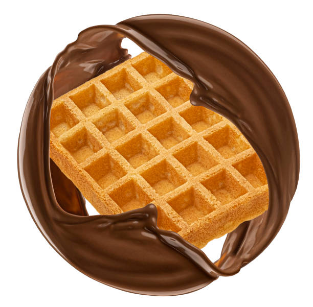 istock Waffle and chocolate splash isolated on white background 1975097395