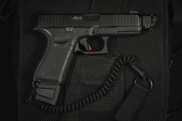 istock Tactical pistol g19 with muzzle brake and safety cord. 1975097416