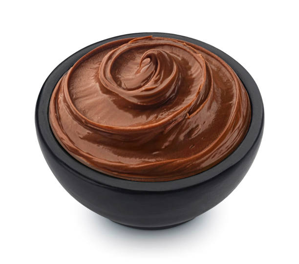 istock Hazelnut cream in black bowl isolated on white background 1975098502