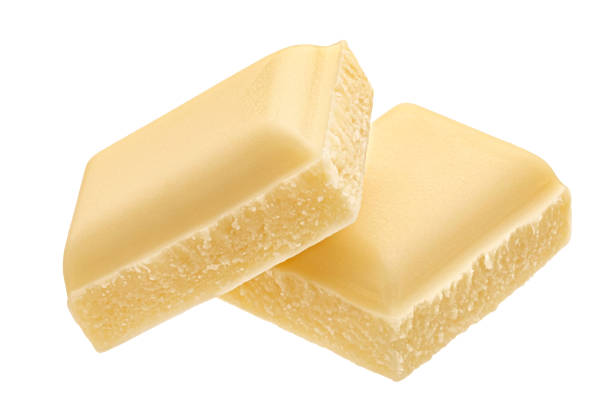 White milk chocolate pieces isolated on white background, full depth of field