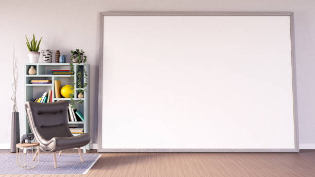istock Living room with an empty picture frame on a wooden floor 3d render 1975124639