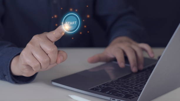 istock Businessman designer touching virtual button start. New start, beginning, business concept 1975159933