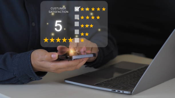 istock close up Man hand using mobile with popup five star icon for feedback review satisfaction service, Customer service experience and business satisfaction survey. 1975161996
