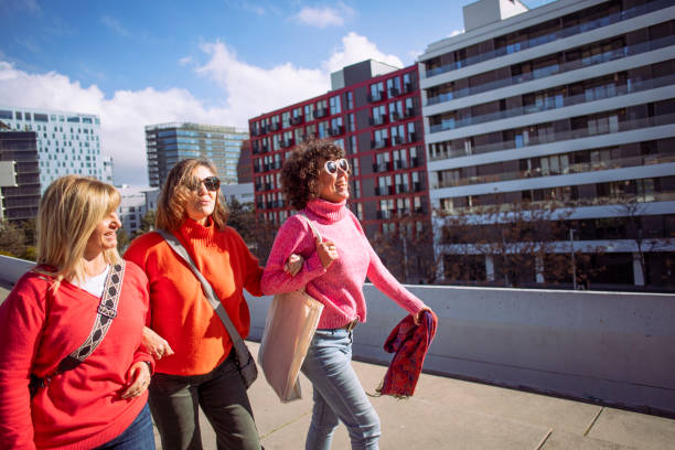 Three friends out for a walk, wearing colorful clothes