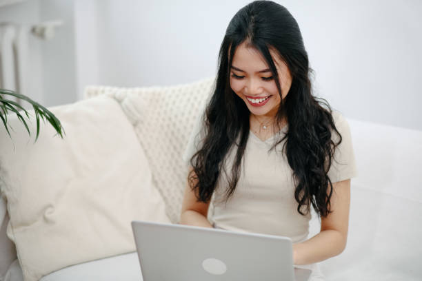 istock Young attractive woman working with computer at home. 1975215376