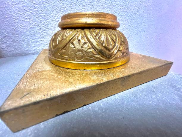 istock scale model of golden architectural element on gray marble slab 1975246393