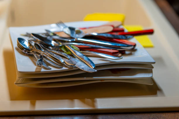cutlery on a plate in the kitchen in selective focus