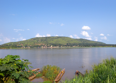 Lake Bunyonyi - July 14, 2019: Local people on the boat look at me, in Lake Bunyonyi, Uganda