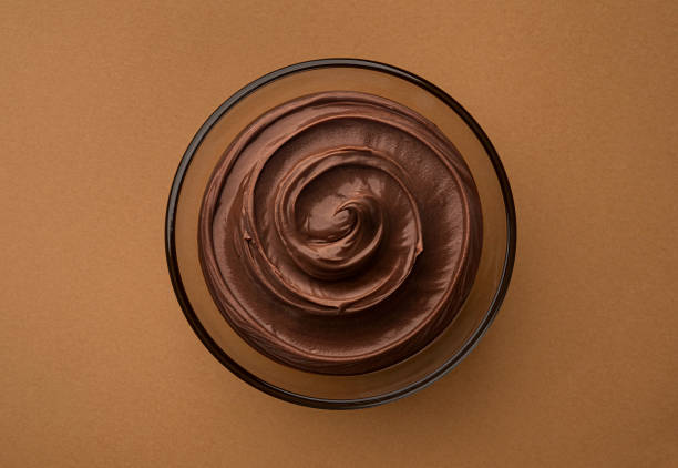 istock Glass bowl of hazelnut cream, top view 1975282408