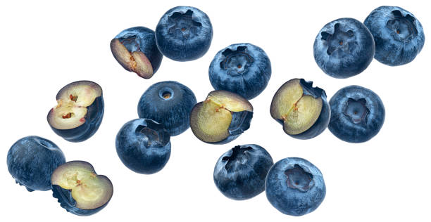 istock Falling blueberries, bilberry halves isolated on white background 1975282935