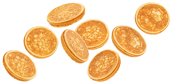 Falling pancakes isolated on white background with clipping path