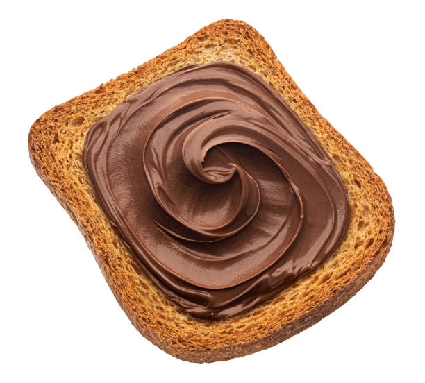 istock Bread rusk with hazelnut cream isolated on white background, top view 1975282944