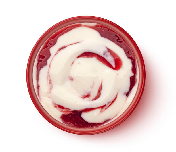 istock Yogurt with berry jam swirl isolated on white background, top view 1975282961